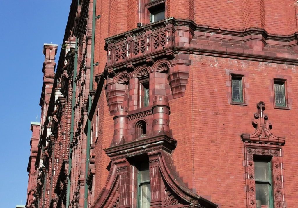 Story 9 Kimpton Clocktower details castle and scallops